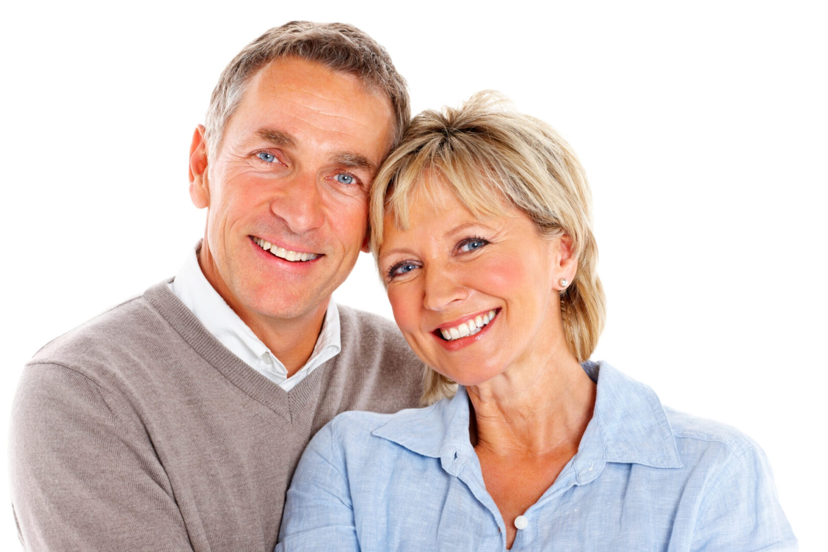 Portrait of loving mature couple smiling together against white background
